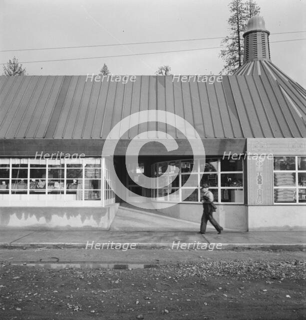 Stores and community center in model lumber company town, Gilchrist, Oregon, 1939. Creator: Dorothea Lange.