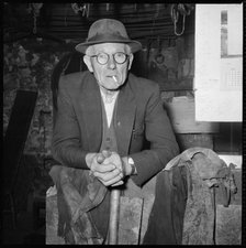Elderly man posed in a workshop, 1967. Creator: Eileen Deste.