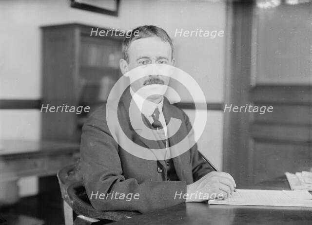 H.L. Stimson at desk writing, 1910. Creator: Bain News Service.