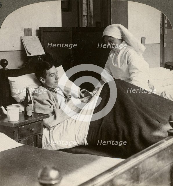 A soldier writing a letter in hospital, World War I, 1914-1918.Artist: Realistic Travels Publishers