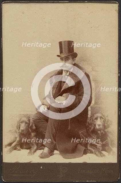 Portrait of a Moustachioed Seated Man in Top Hat and Winter, Fur-Collared Coat..., about 1890. Creator: Lewis Peavey.
