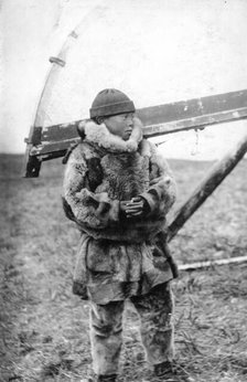 Chukchi boy in national clothes, kukhlyanka, fur pants, 1910-1929. Creator: Ivan Emelianovich Larin.
