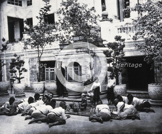 Prince Chulalongkorn of Siam (Thailand) (seated, centre), with Prince Bhanugrangsi..., 1866. Creator: John Thomson.