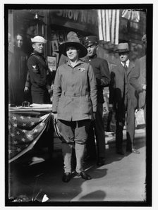 Dora Rodrigues, recruiter for service branches, possibly in front of the Cosmos Theater..., May 1917 Creator: Harris & Ewing.