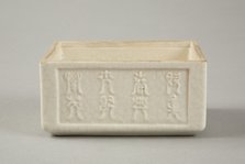 Soft paste rectangular vessel with characters in relief, early 19th century. Artist: Unknown.