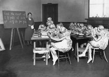A classroom scene, c1910-1929(?). Artist: Unknown
