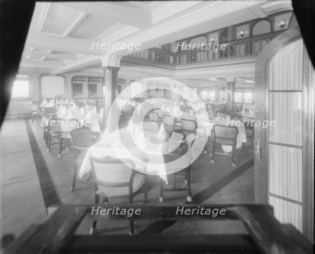 Interior shot of dining room, possibly the Royal Yacht Squadron, Cowes. Creator: Kirk & Sons of Cowes.