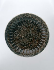 Brown Ding saucer with moulded floral decoration, Jin dynasty, China, late 12th-early 13th century. Artist: Unknown