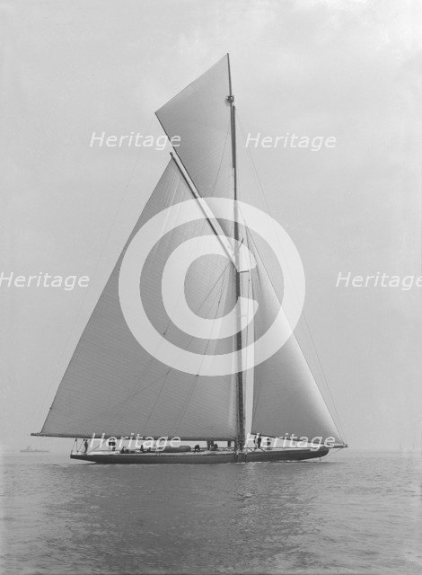 The towering 10,450 sq ft sail area of 'Shamrock IV', 1914. Creator: Kirk & Sons of Cowes.
