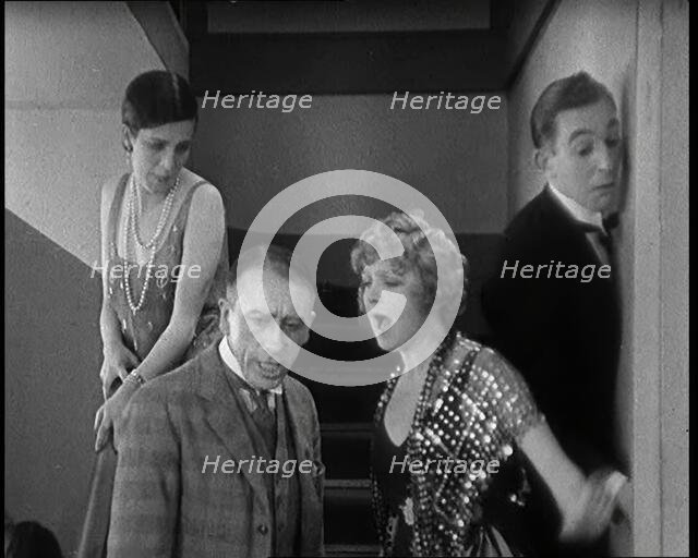 Scene from the Film 'Champagne': Betty Balfour Arguing With Her Companions, 1920s. Creator: British Pathe Ltd.