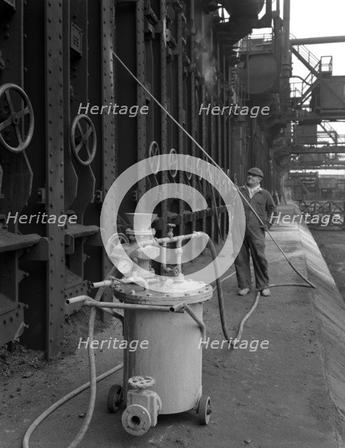 Spraying the ovens at Manvers coking works near Rotherham, South Yorkshire, 1963. Artist: Michael Walters