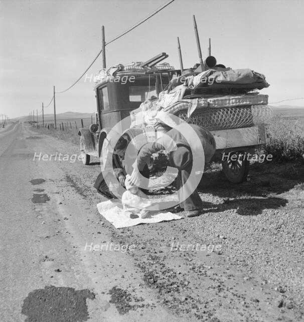 Missouri family of five on U.S. Highway 99 near Tracy, California, 1937. Creator: Dorothea Lange.