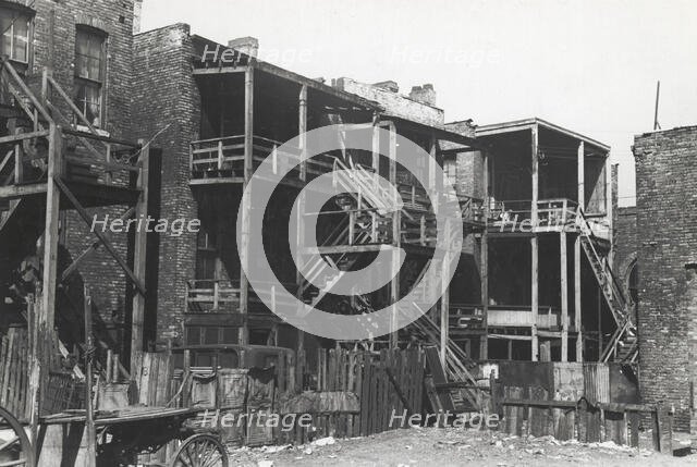 Back steps of apartments in Negro section of Chicago, Illinois, April 1941. Creators: Farm Security Administration, Russell Lee.