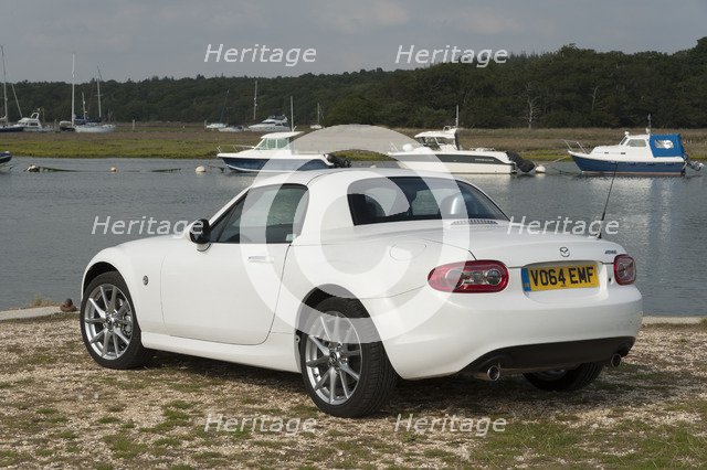 2014 Mazda MX5 Roadster Coupe Artist: Unknown.