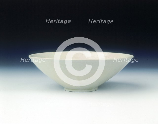 White ware bowl with moulded twin fish and floral pattern, Jin dynasty, China, 12th century. Artist: Unknown