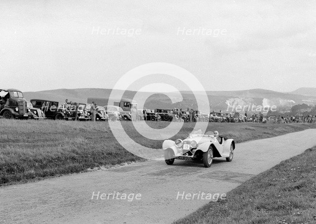 Jaguar SS100 of LJ Simmons competing at the Lewes Speed Trials, Sussex, 1938. Artist: Bill Brunell.