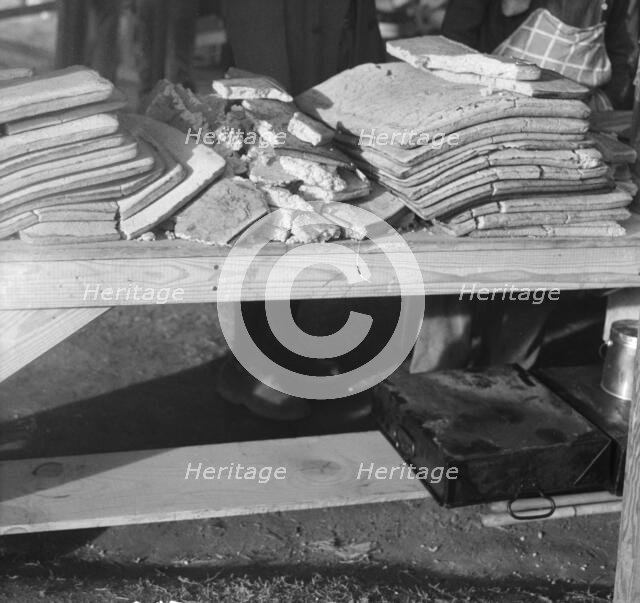 Cornbread, Food for flood refugees at the Forrest City concentration camp, Arkansas, 1937. Creator: Walker Evans.