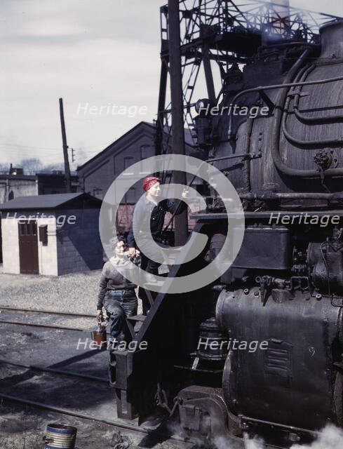 Women wipers of the Chicago and North Western Railroad cleaning one of the..., Clinton, Iowa, 1943. Creator: Jack Delano.