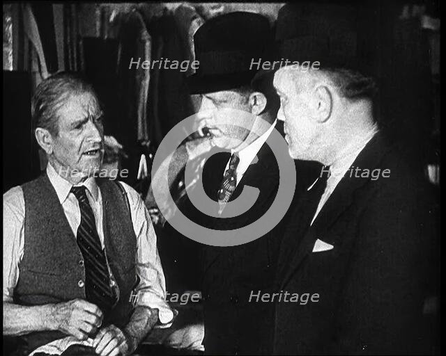 Elderly Male Civilian Being Threatened For Protection Money By Two Male Civilians, 1932. Creator: British Pathe Ltd.