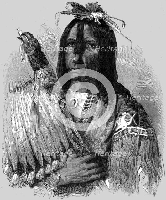 'Hashquaht Chief, in War Dress; In pawn in an Indian village', 1875.  Creator: Unknown.