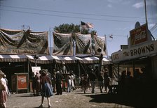 Barker at the grounds of the Vermont state fair, Rutland, 1941. Creator: Jack Delano.