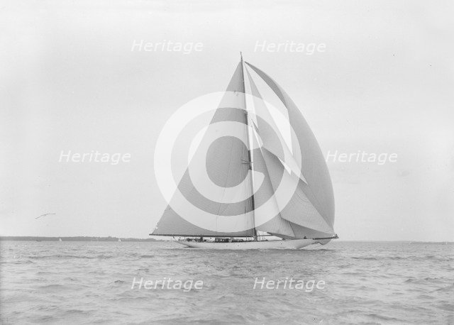The 23-metre cutter 'Astra' sailing with spinnaker.  Creator: Kirk & Sons of Cowes.