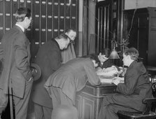 New citizens signing naturalization papers in judge's chambers, 1910. Creator: Bain News Service.