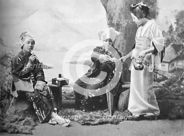 Japanese peasant girls taking tea at a wayside rest, 1902. Artist: Unknown.