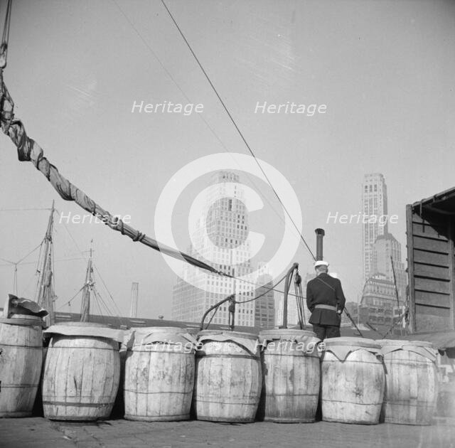Barrels of fish on the docks at Fulton fish market ready to be shipped to..., New York, 1943. Creator: Gordon Parks.