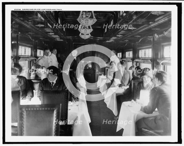 Dining car on a deluxe overland limited train, between 1910 and 1920. Creator: Unknown.