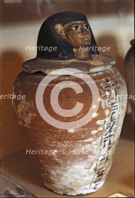 Canopic vase in clay.