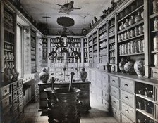 A seventeenth-century German apothecary's shop with ornate pharmacy jars..., c1900s. Creator: Christof Muller.
