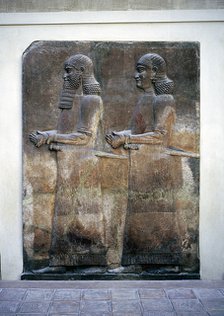 Assyrian relief of two servants, Palace of Sargon II, Khorsabad, c8th century BC. Artist: Unknown