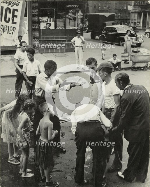 Eastside - Group of men and youths gathered around an accident victim; one young..., 1947 - 1951. Creator: Romulo Lachatanere.
