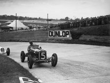 ERA and Maserati taking a corner in a race at Brooklands. Artist: Bill Brunell.