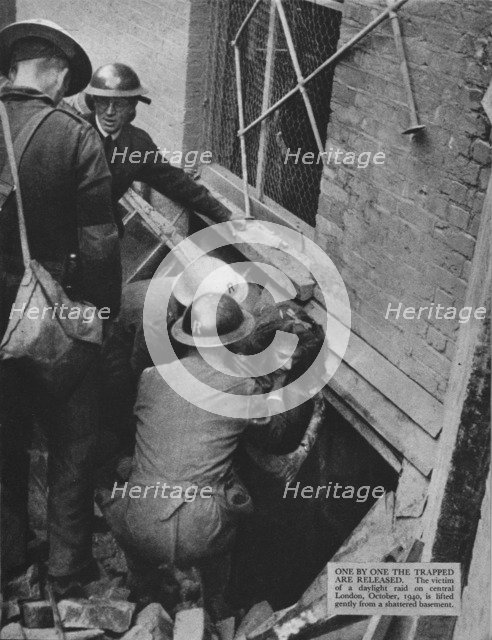 'One by one the trapped are released', 1940 (1942). Artist: Unknown.