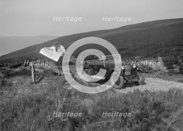 Kitty Brunell road testing a Riley 9 WD tourer, c1930. Artist: Bill Brunell.