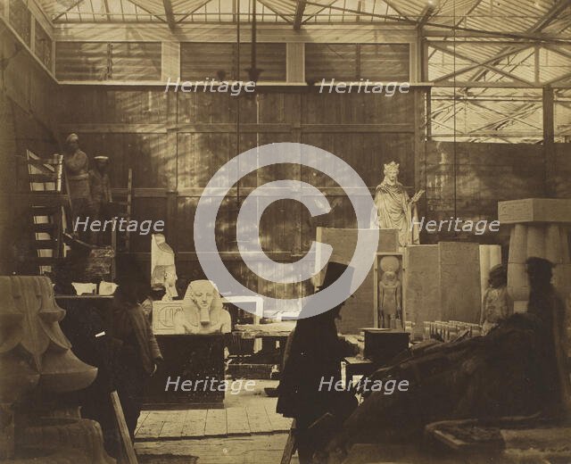 [Storeroom with Artisans and Plaster Casts, Crystal Palace], 1852. Creator: Philip Henry Delamotte.