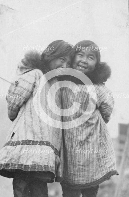 Two Eskimo girls standing side by side, between c1900 and c1930. Creator: Unknown.