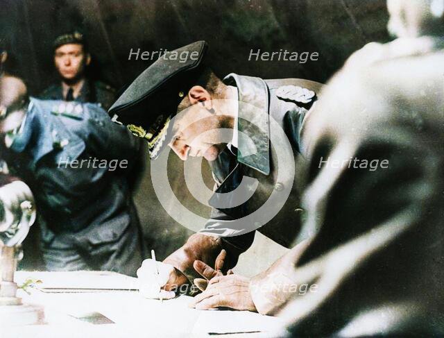 Rear-Admiral Gerhard Wagner signing the German surrender document ending World War II, 1945. Creator: Unknown.