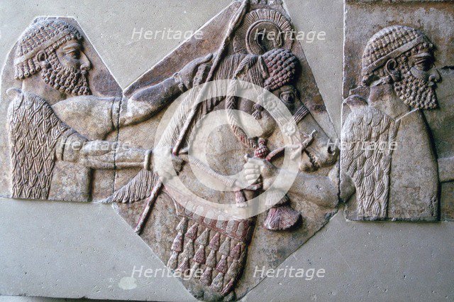 Assyrian relief of a man leading a horse and rider. Artist: Unknown