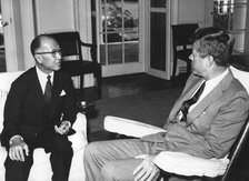 President John F. Kennedy talking with SEATO Secretary General Pote Sarasin, 1962. Artist: Unknown