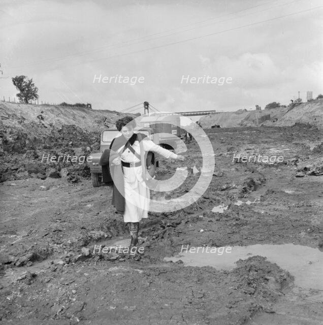 A site nurse at Section B3 of the London to Yorkshire Motorway (the M1), Milton Keynes, 09/1958. Creator: John Laing plc.