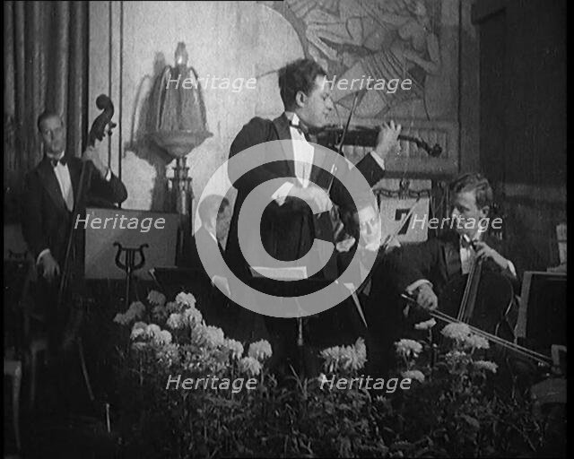 British Celebrated Violinist Albert Sandler, Born Abraham Sandler, Playing the Violin with..., 1920. Creator: British Pathe Ltd.