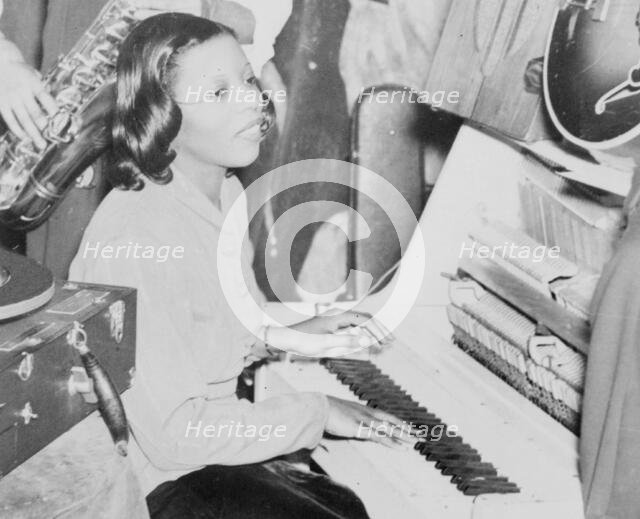 Portrait of Mary Lou Williams, Howard Theater, Washington, D.C., 1938. Creator: William Paul Gottlieb.