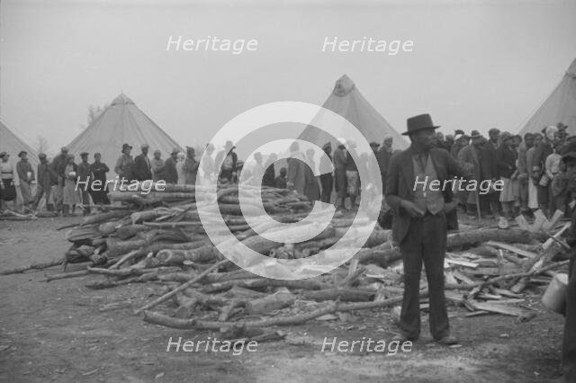 Possibly: Negroes in the lineup for food at meal time in the camp..., Forrest City, Arkansas, 1937. Creator: Walker Evans.
