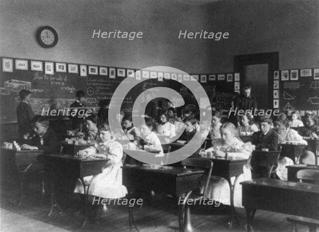 Children in school in Washington, D.C. - studying geometry, (1899?). Creator: Frances Benjamin Johnston.
