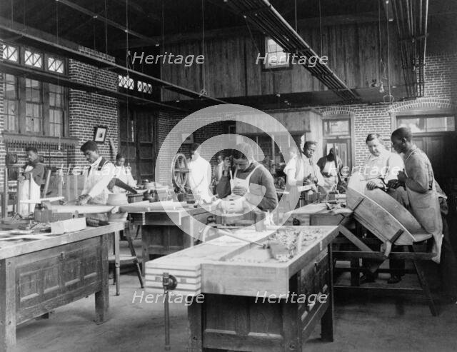 Young men training in wheel wrighting at Hampton Institute, Hampton, Virginia, 1899 or 1900. Creator: Frances Benjamin Johnston.