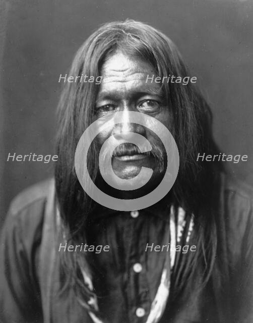 Hoo-Man-Hai, Maricopa Indian, head-and-shoulders portrait, facing front, c1907. Creator: Edward Sheriff Curtis.