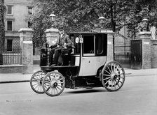 An electric motor cab and driver, London, c1897-c1900. Artist: York & Son.